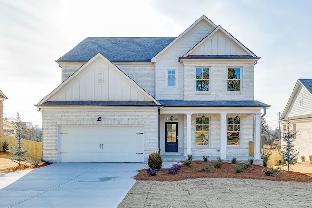 view of front facade featuring a porch and a garage