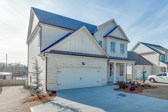 view of front of home featuring a garage and a porch