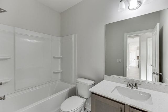 full bathroom with washtub / shower combination, vanity, and toilet