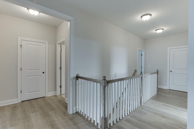 corridor featuring light hardwood / wood-style floors