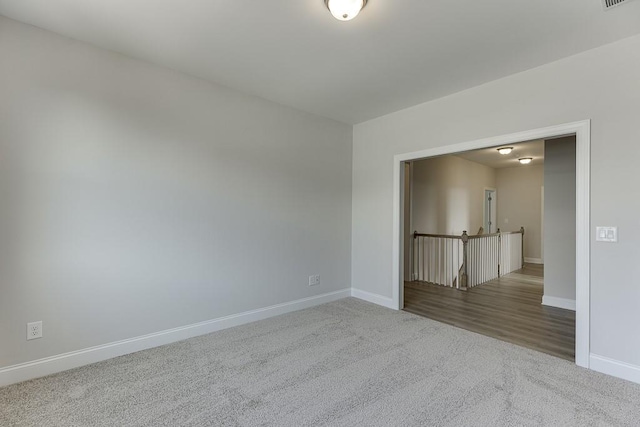 unfurnished room featuring carpet