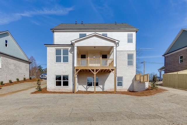 rear view of house with a balcony