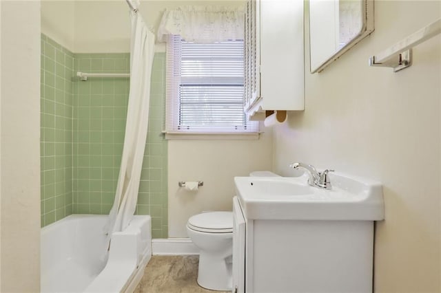 bathroom featuring shower / tub combo, vanity, and toilet