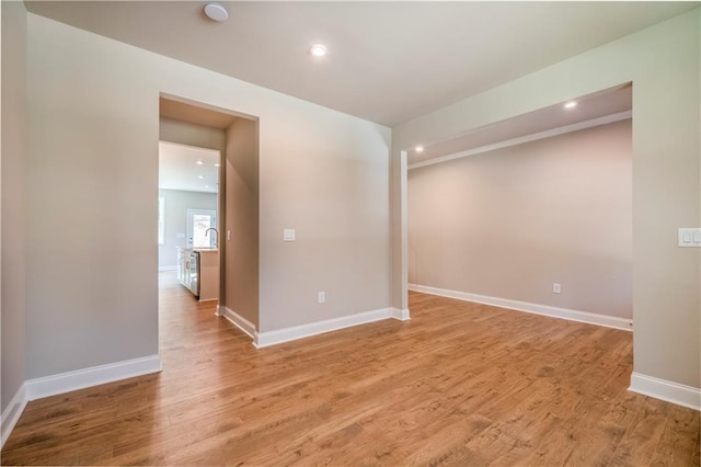 unfurnished room with light hardwood / wood-style floors