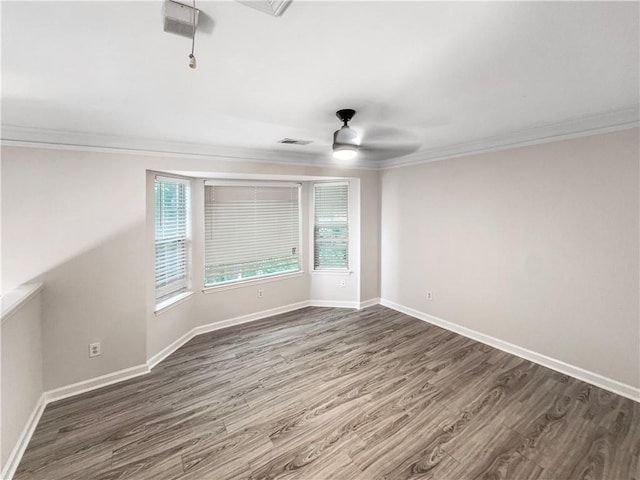 unfurnished room with ceiling fan, wood-type flooring, and ornamental molding