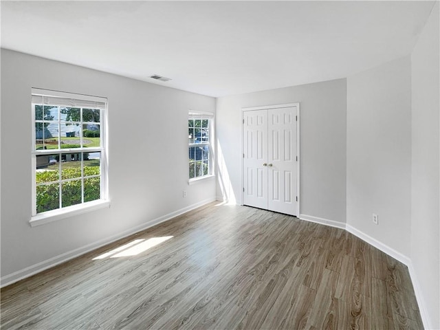 empty room with wood-type flooring