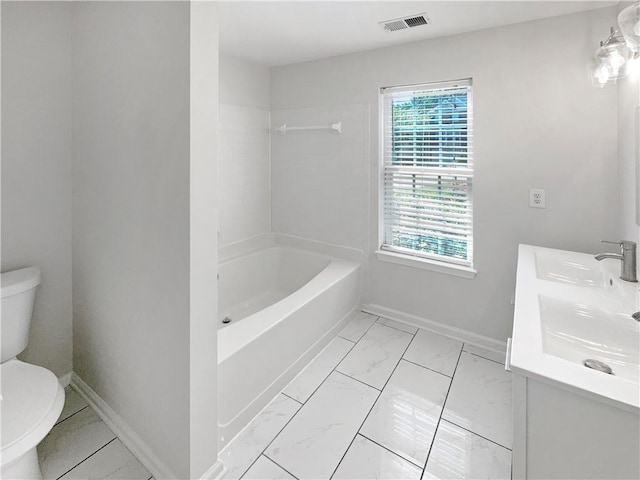 full bathroom featuring tile patterned flooring, vanity, toilet, and tiled shower / bath