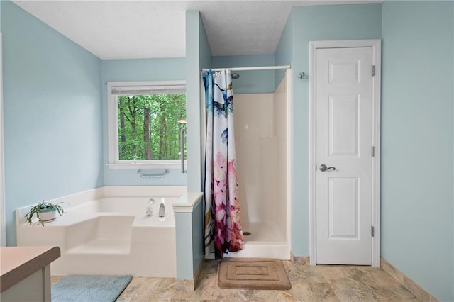 125 Misty Lea Dr, Dallas, GA 30132 - full bathroom with a stall shower, a bath, vanity, and a textured ceiling