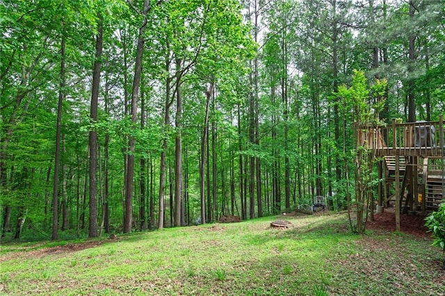 125 Misty Lea Dr, Dallas, GA 30132 - view of yard with a wooden deck and a wooded view