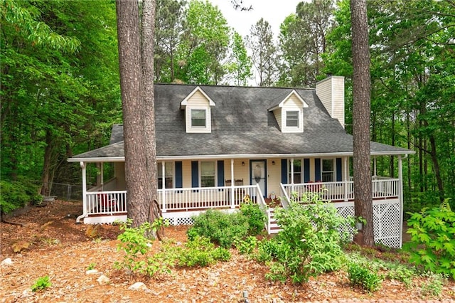 125 Misty Lea Dr, Dallas, GA 30132 - cape cod-style house featuring covered porch, a chimney, and roof with shingles