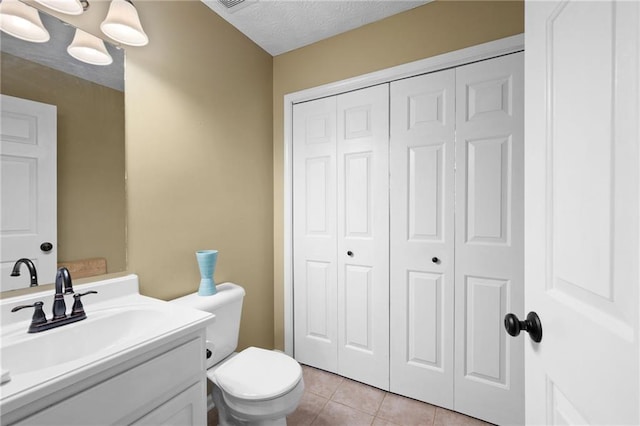 125 Misty Lea Dr, Dallas, GA 30132 - bathroom featuring a closet, toilet, vanity, and tile patterned flooring