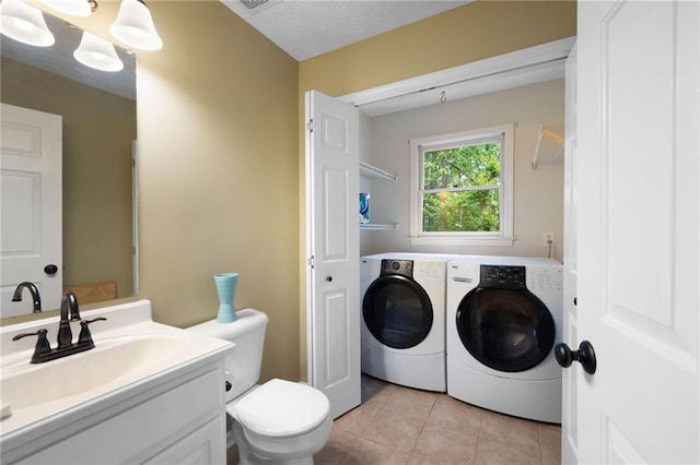 125 Misty Lea Dr, Dallas, GA 30132 - bathroom featuring washer and clothes dryer, tile patterned floors, toilet, and vanity