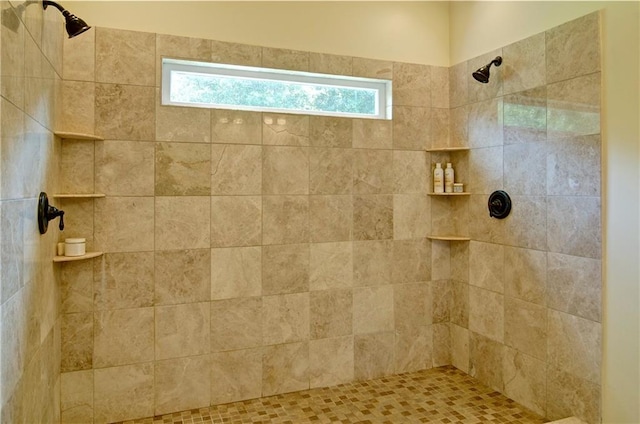 bathroom featuring tiled shower