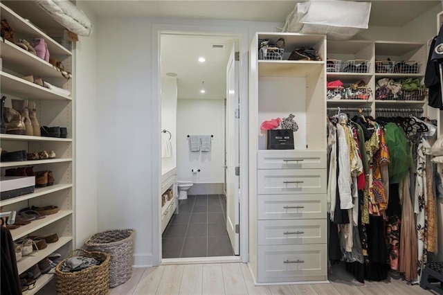 walk in closet featuring light wood-style flooring