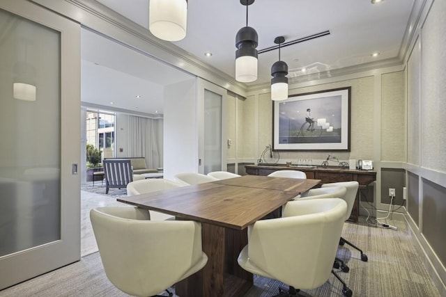 carpeted dining area with recessed lighting and crown molding