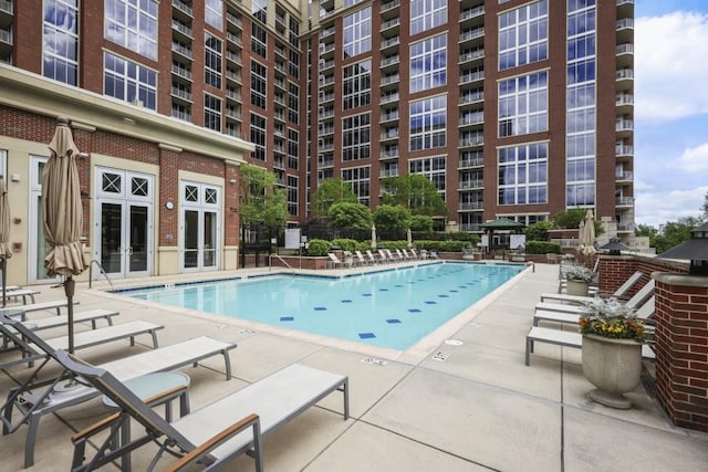 community pool featuring a patio area