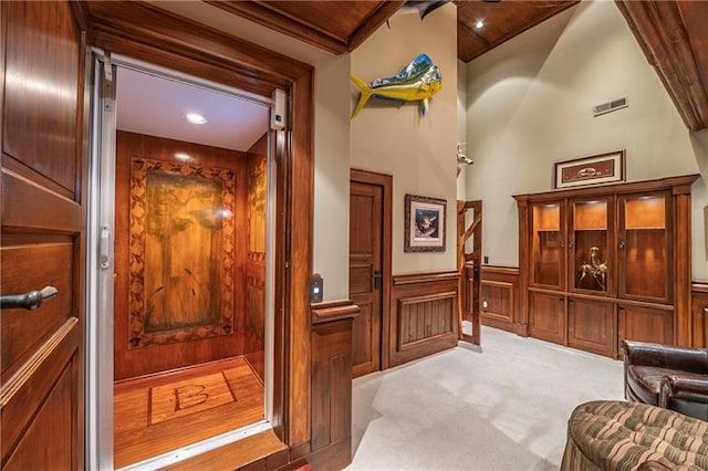 3406 Thunder Pt, Gainesville, GA 30506 - hall featuring a wainscoted wall, light carpet, and a decorative wall