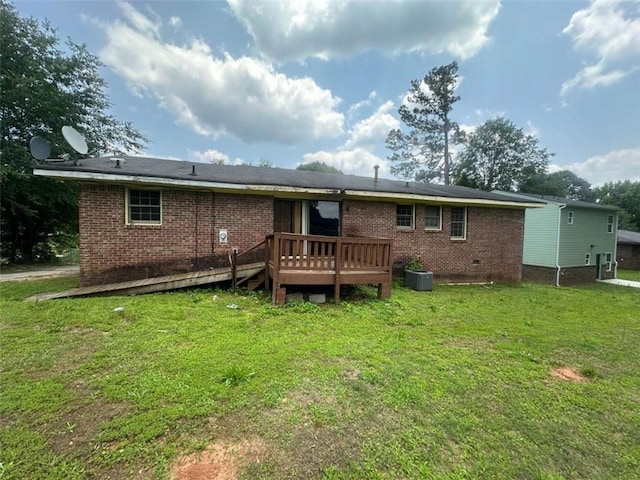 9160 Carr Cir, Covington, GA 30014 - back of property with a deck, a lawn, brick siding, and crawl space