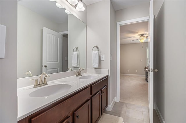 4815 Edgemoore Trce, Cumming, GA 30040 - bathroom featuring double vanity, baseboards, ceiling fan, and tile patterned floors