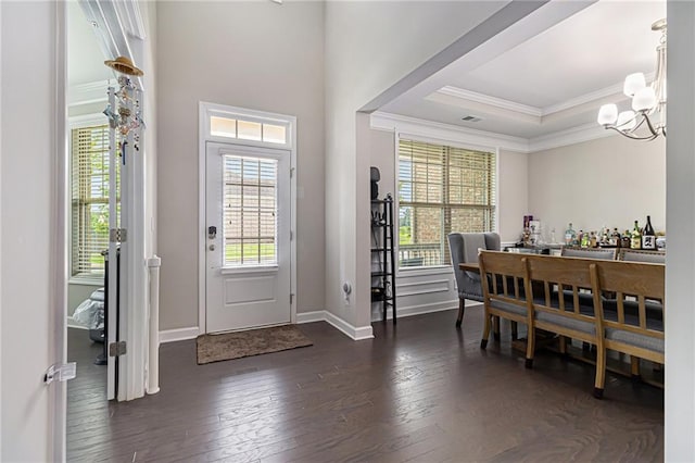 4815 Edgemoore Trce, Cumming, GA 30040 - foyer with ornamental molding, dark wood finished floors, a chandelier, baseboards, and a raised ceiling