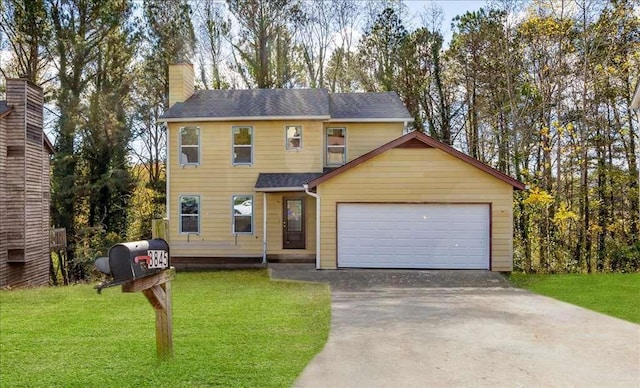 view of front facade featuring a front yard and a garage