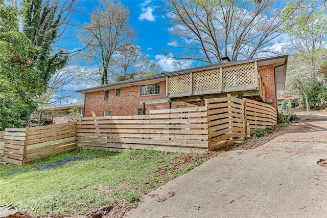 613 Holly Dr, Gainesville, GA 30501 - view of side of property featuring brick siding and fence