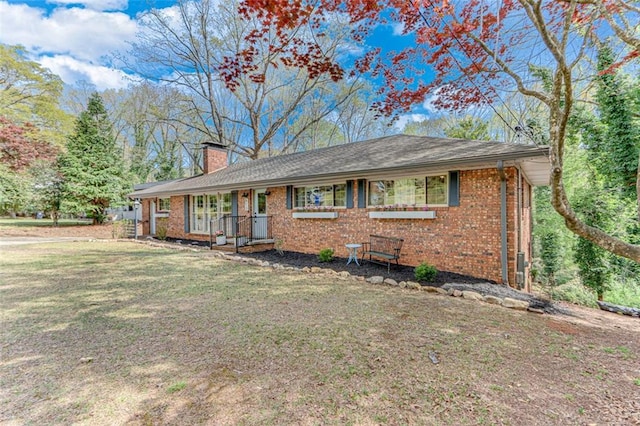 613 Holly Dr, Gainesville, GA 30501 - single story home with a chimney, a front yard, and brick siding