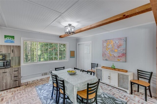 613 Holly Dr, Gainesville, GA 30501 - dining area featuring brick floor, visible vents, and a chandelier