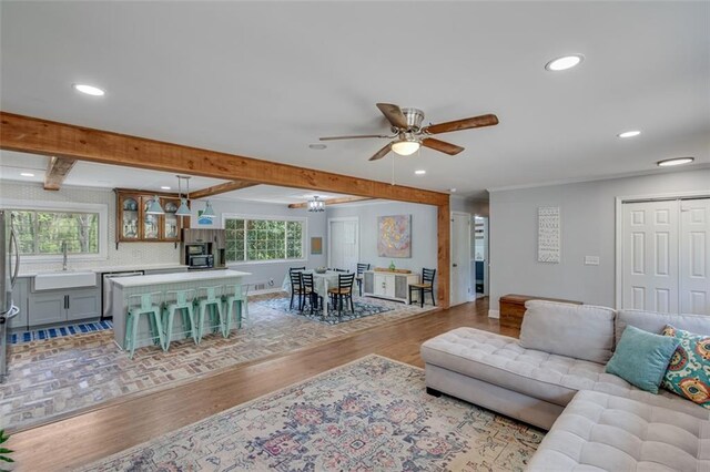 613 Holly Dr, Gainesville, GA 30501 - living room with baseboards, beamed ceiling, light wood-style floors, ceiling fan, and recessed lighting