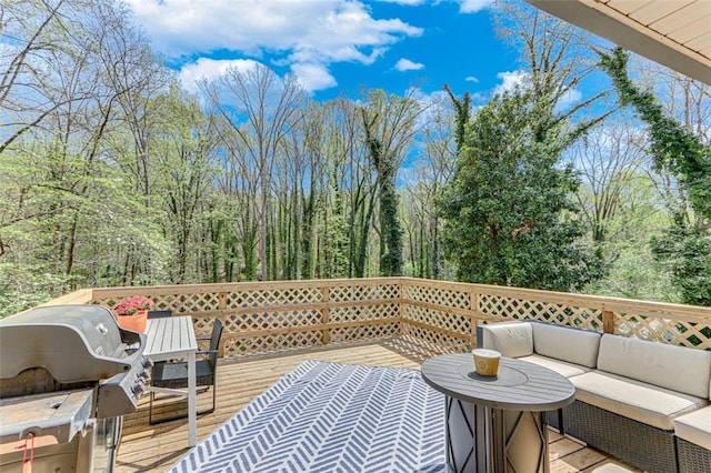 613 Holly Dr, Gainesville, GA 30501 - wooden deck featuring grilling area, an outdoor hangout area, and a forest view