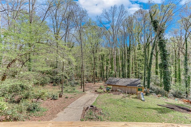 613 Holly Dr, Gainesville, GA 30501 - view of yard featuring an outbuilding and a wooded view