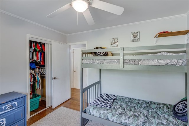 613 Holly Dr, Gainesville, GA 30501 - bedroom featuring a closet, wood finished floors, ornamental molding, and a ceiling fan