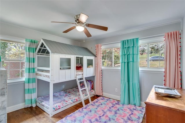 613 Holly Dr, Gainesville, GA 30501 - bedroom with baseboards, wood finished floors, ornamental molding, and a ceiling fan