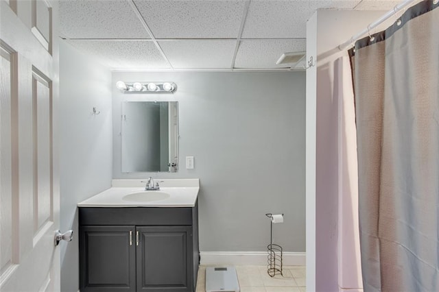 613 Holly Dr, Gainesville, GA 30501 - full bathroom featuring tile patterned flooring, vanity, baseboards, and a paneled ceiling