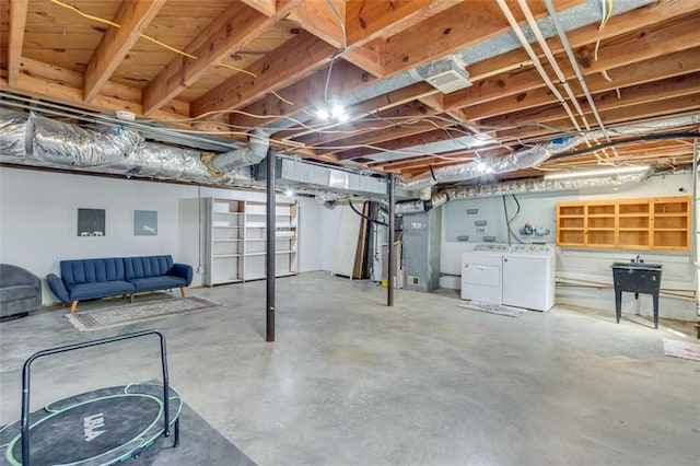 613 Holly Dr, Gainesville, GA 30501 - unfinished below grade area featuring washing machine and dryer and electric panel