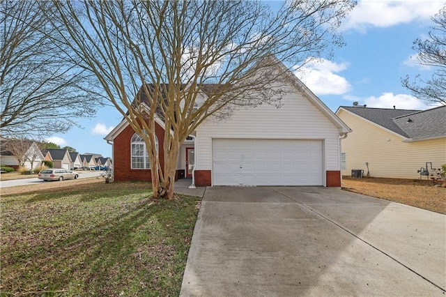 view of front of property featuring a garage and a front lawn