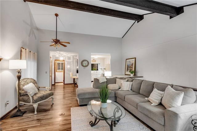 200 Villa Rd Unit 125, Jasper, GA 30143 - living room featuring high vaulted ceiling, beam ceiling, light wood finished floors, a ceiling fan, and baseboards