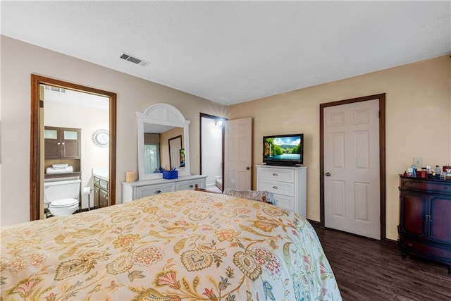 200 Villa Rd Unit 125, Jasper, GA 30143 - bedroom with dark wood-type flooring, connected bathroom, and baseboards
