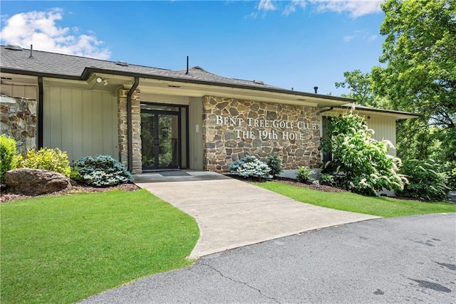 200 Villa Rd Unit 125, Jasper, GA 30143 - view of front facade featuring stone siding, a shingled roof, and a front yard
