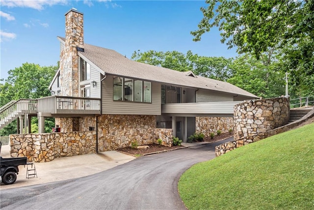 200 Villa Rd Unit 125, Jasper, GA 30143 - view of front of house featuring stone siding, a chimney, stairway, a shingled roof, and a wooden deck
