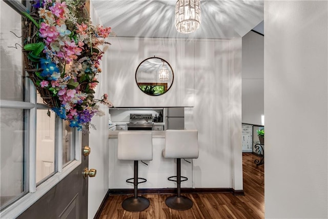 200 Villa Rd Unit 125, Jasper, GA 30143 - detailed view of wood finished floors, baseboards, a chandelier, and high end stainless steel range oven