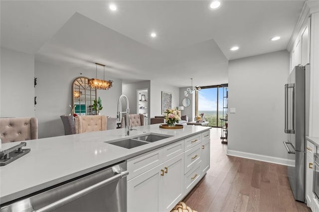 270 17th St NW Unit 2804, Atlanta, GA 30363 - kitchen with stainless steel appliances, light countertops, dark wood-type flooring, white cabinetry, and recessed lighting
