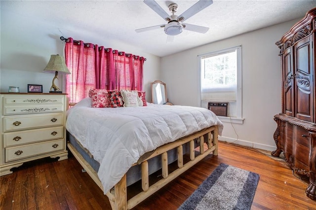 bedroom with cooling unit, ceiling fan, and hardwood / wood-style flooring