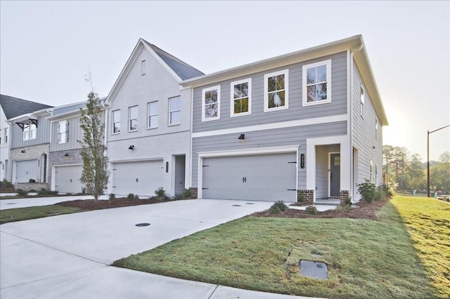 view of front facade with a garage and a front lawn