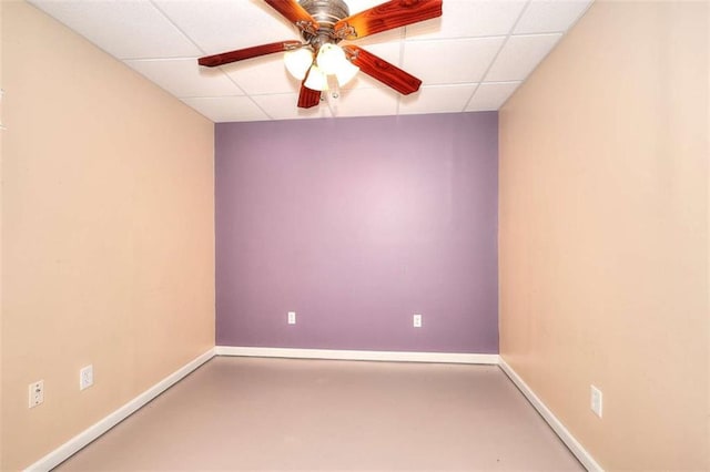 662 Shady Willow Ln, Loganville, GA 30052 - unfurnished room with a drop ceiling, baseboards, a ceiling fan, and finished concrete flooring