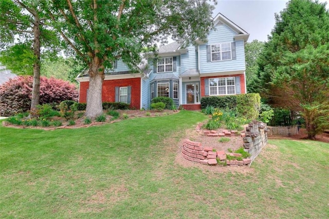 662 Shady Willow Ln, Loganville, GA 30052 - traditional-style home featuring brick siding