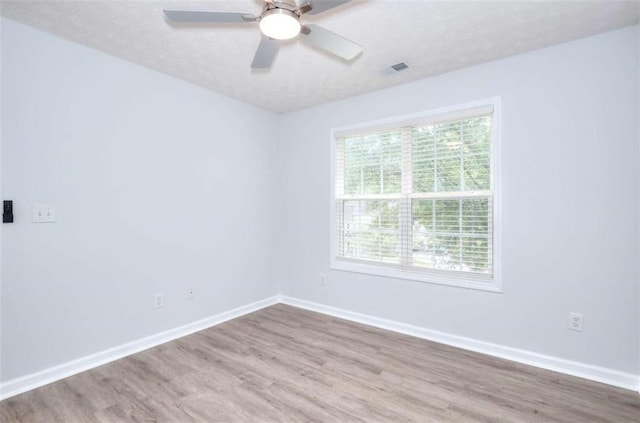 662 Shady Willow Ln, Loganville, GA 30052 - unfurnished room with wood finished floors, a textured ceiling, baseboards, and ceiling fan