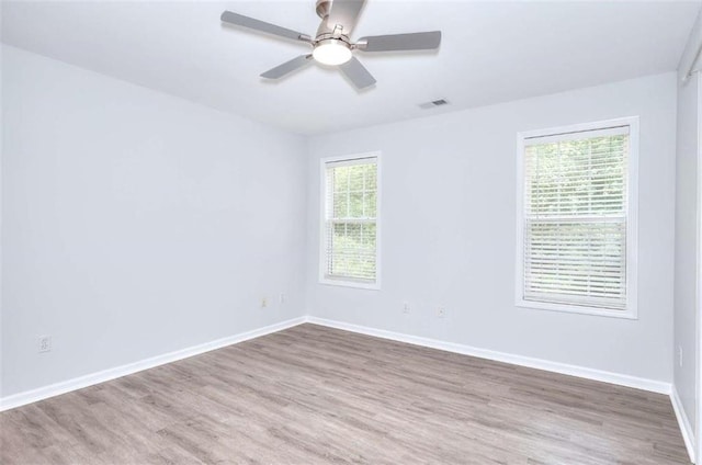662 Shady Willow Ln, Loganville, GA 30052 - empty room featuring wood finished floors, baseboards, and ceiling fan