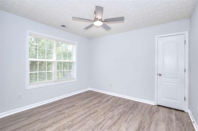 662 Shady Willow Ln, Loganville, GA 30052 - unfurnished room featuring wood finished floors, a textured ceiling, ceiling fan, and baseboards