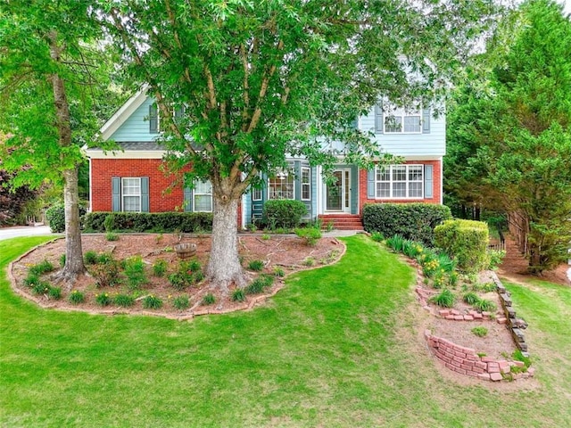 662 Shady Willow Ln, Loganville, GA 30052 - obstructed view of property featuring brick siding and a front lawn